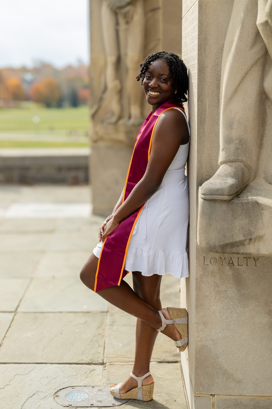 Graduate at the Loyalty pylon
